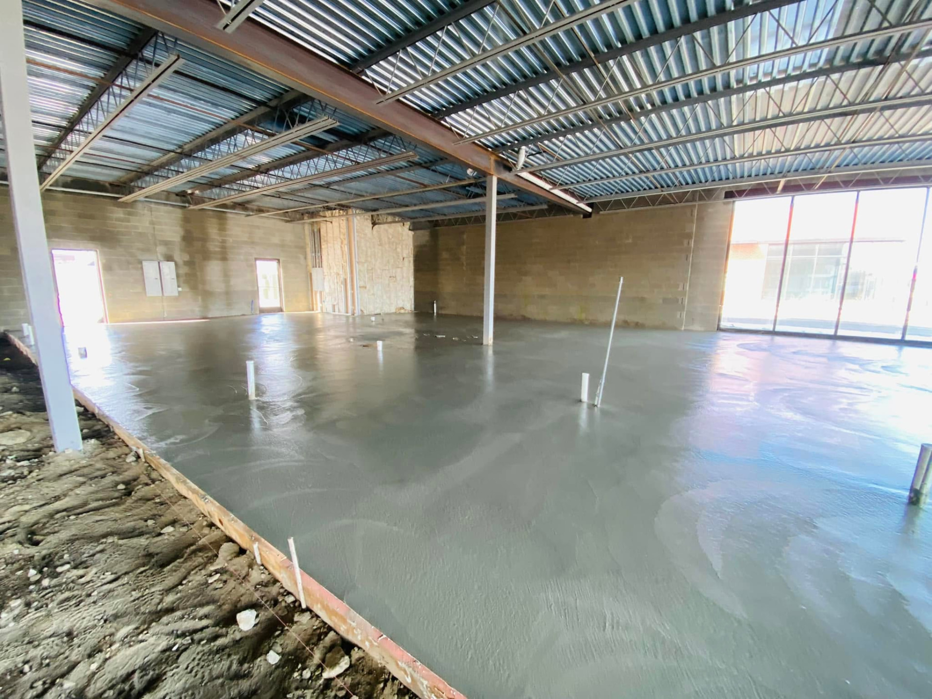 Freshly finished commercial retail concrete floor slab by Marcucci Concrete Construction in Oakland County, Michigan