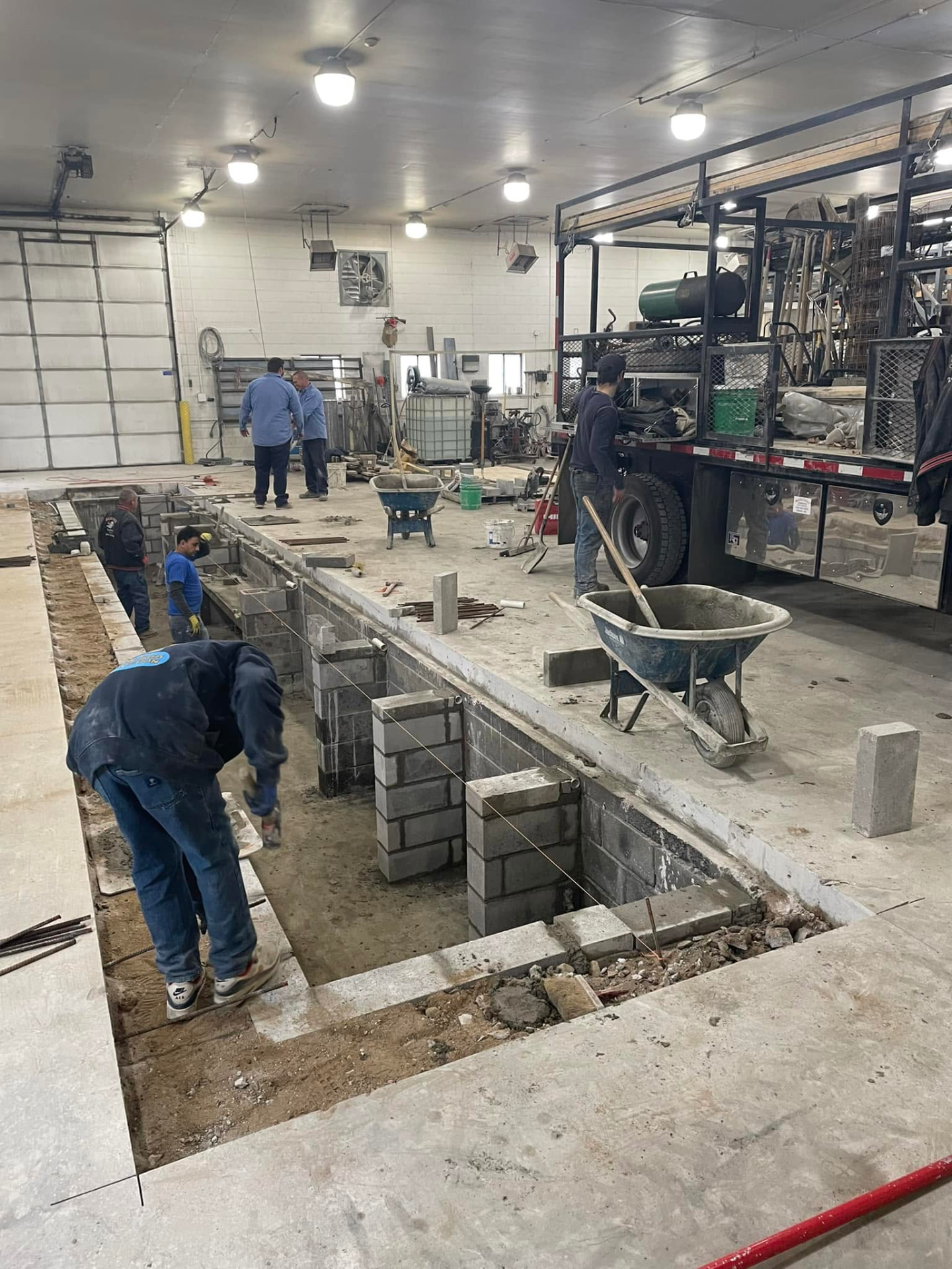 Commercial oil-change shop service pit construction by Marcucci Concrete Construction in Oakland County, Michigan