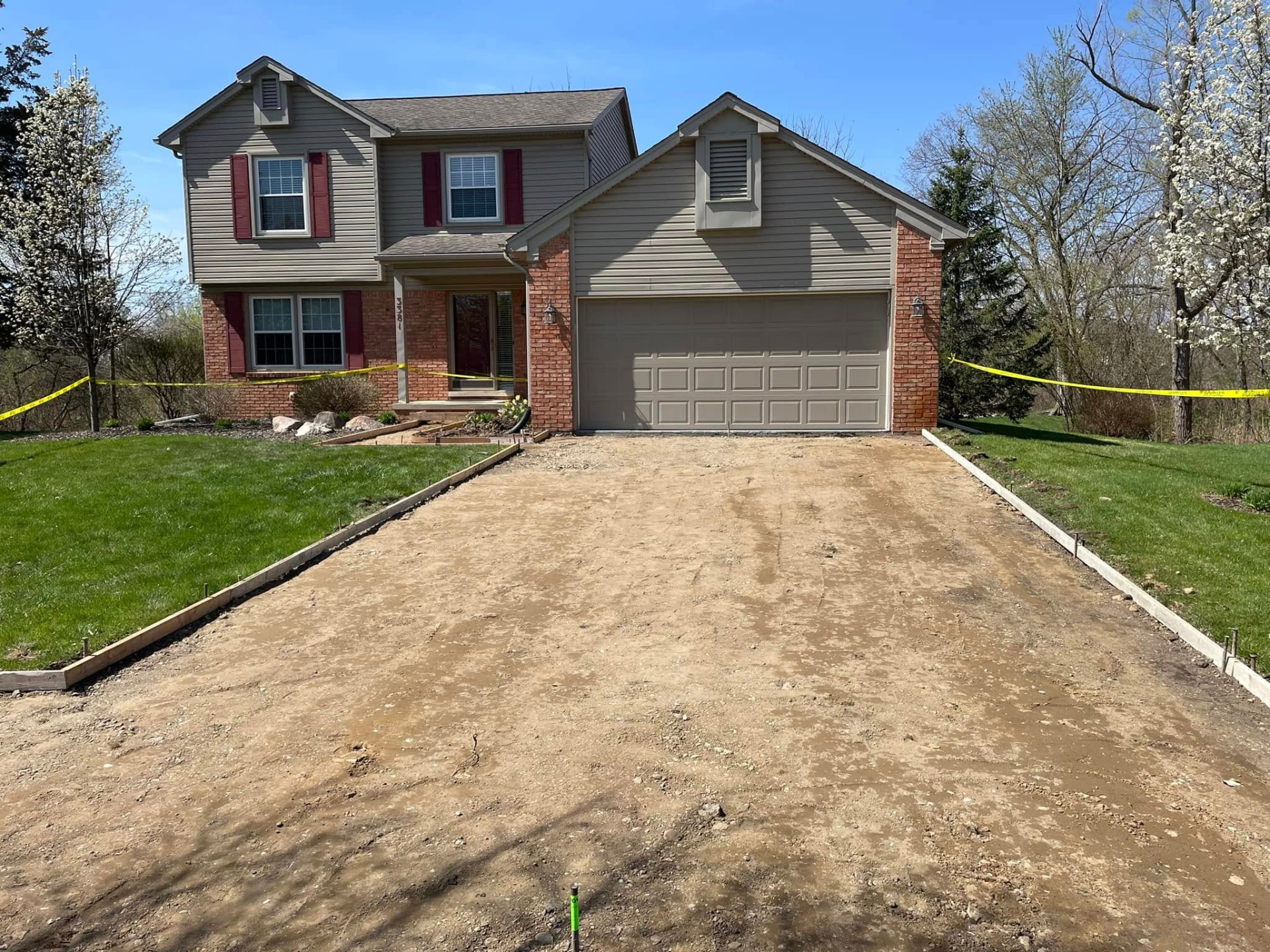 Compacted base and forms prepared for a concrete driveway replacement by Marcucci Concrete Construction in Oakland County, Michigan
