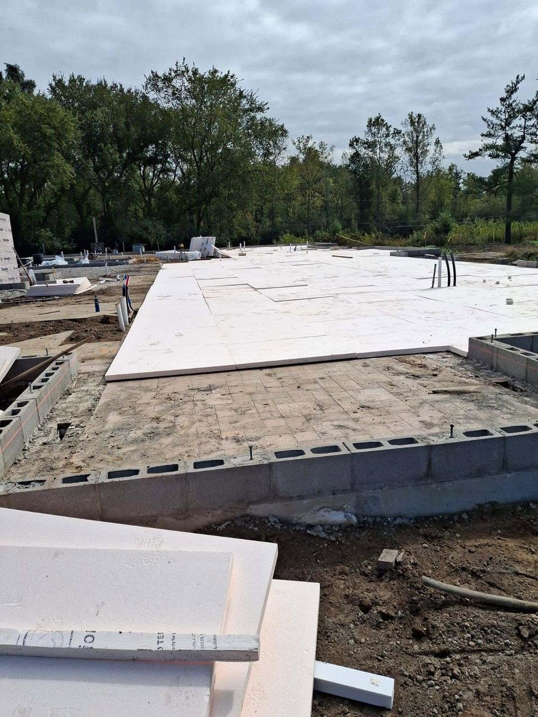 Insulated concrete foundation and slab preparation for new home construction in Oakland County, Michigan