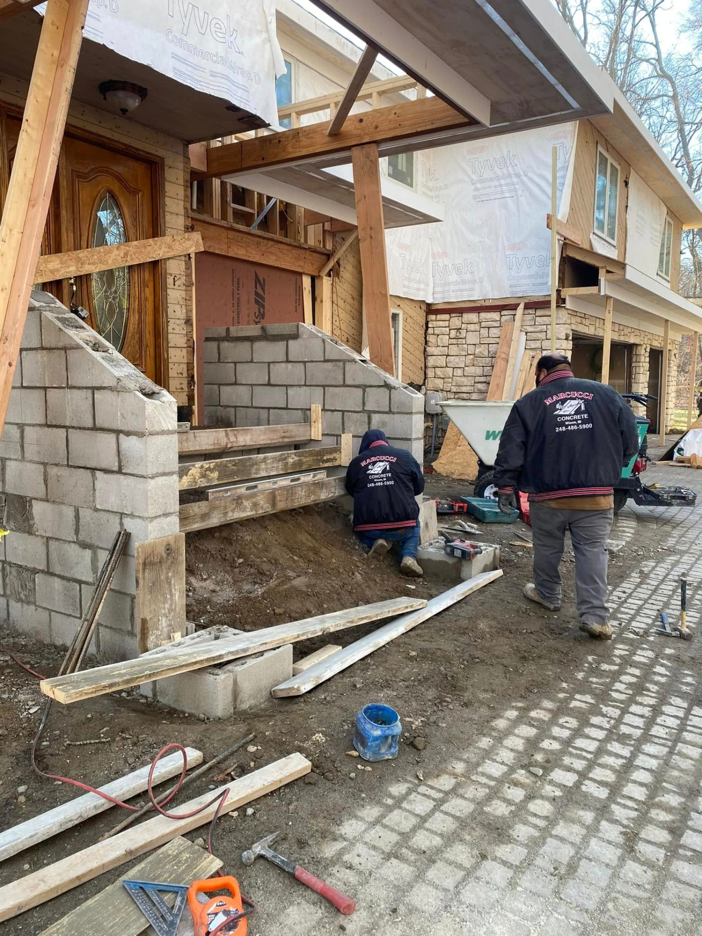Marcucci Concrete Construction building block sidewalls for concrete front steps and porch landing in Oakland County, Michigan