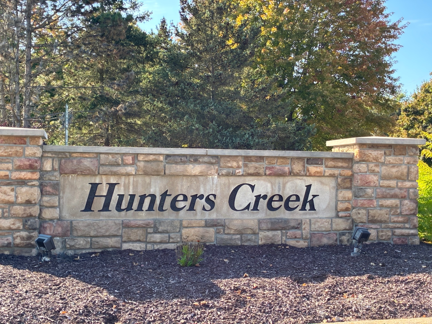 Hunters Creek subdivision stone entrance wall in Lyon Township, Michigan