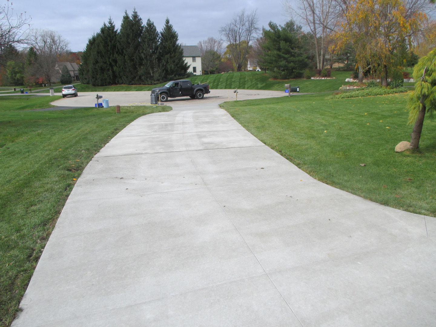 Finished curved concrete driveway with saw-cut control joints, Oakland County, Michigan