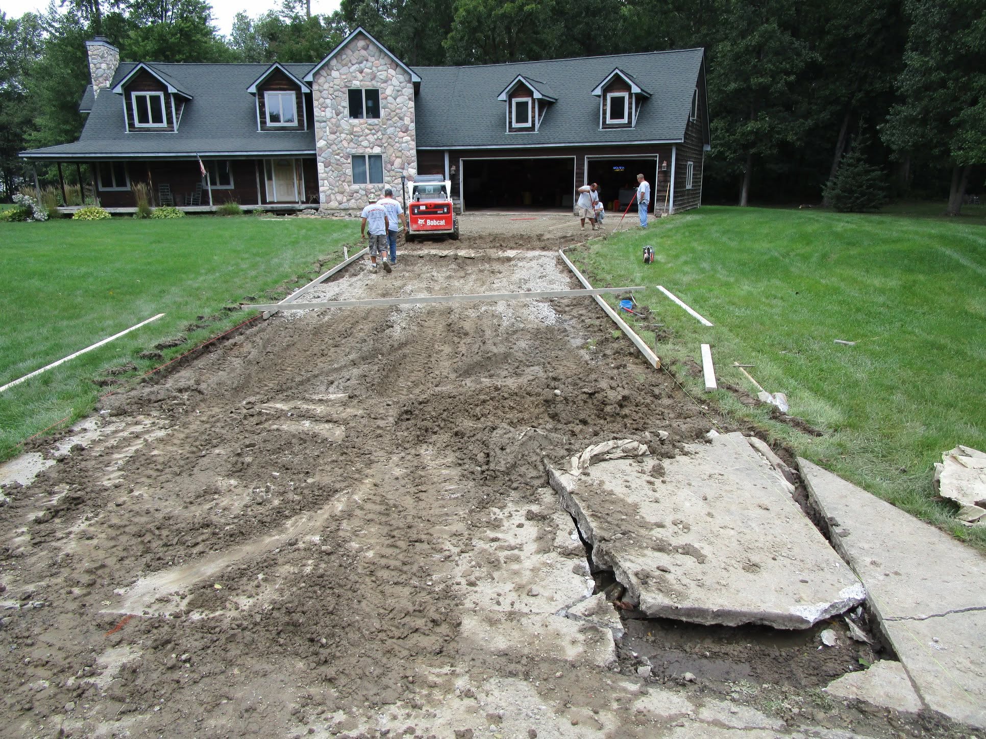 Marcucci crew tearing out an old driveway and forming for new concrete in Oakland County, Michigan