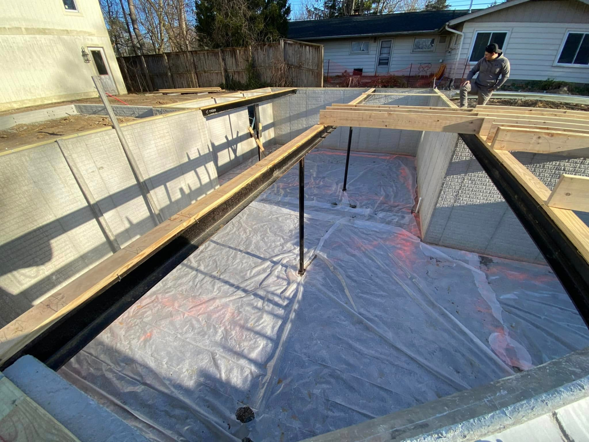 Residential basement foundation with reinforced walls and structural steel by Marcucci Concrete Construction in Oakland County, Michigan