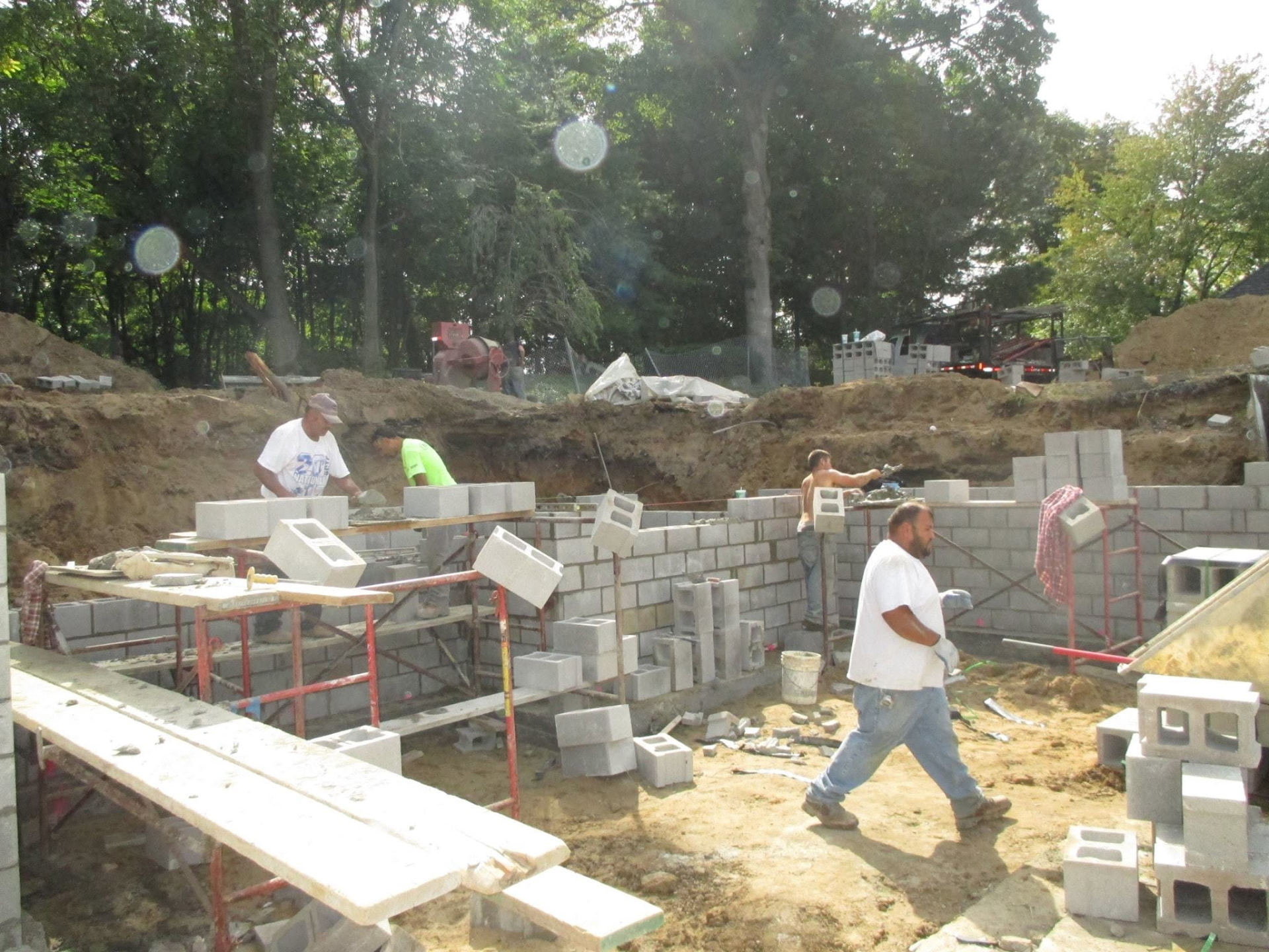 Marcucci Concrete Construction crew laying block foundation walls in Oakland County, Michigan