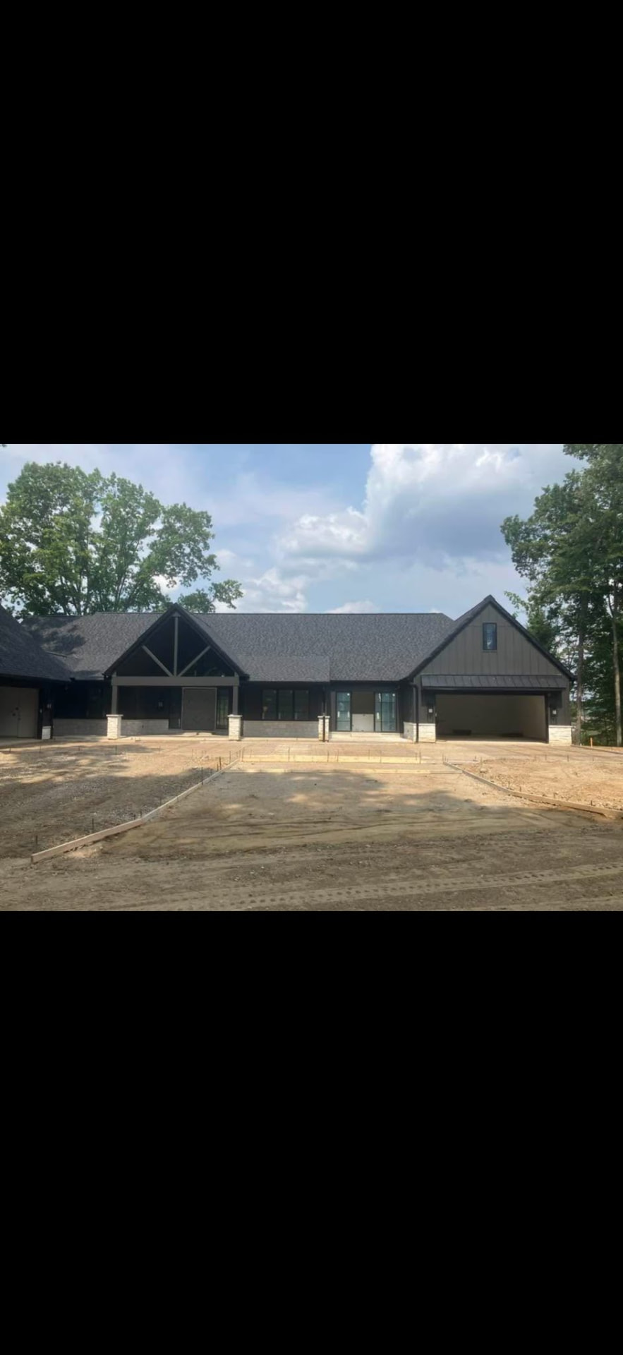 New construction concrete driveway site preparation at a home in Brighton, Michigan