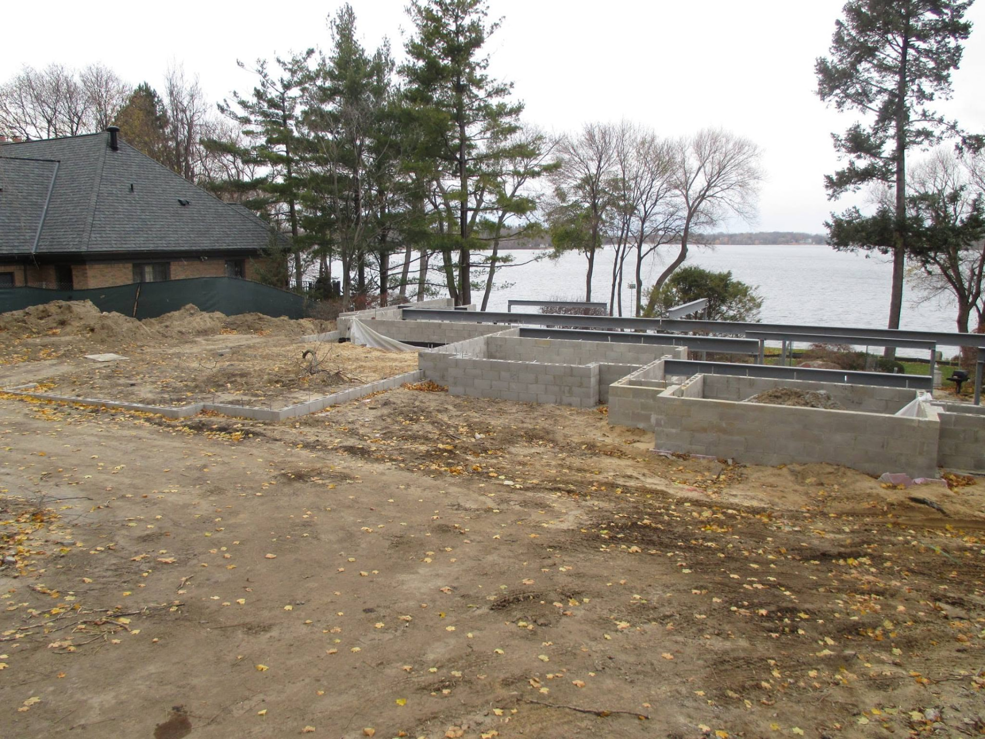 Concrete block foundation with steel beams for a new lakefront home by Marcucci Concrete Construction in Oakland County, Michigan