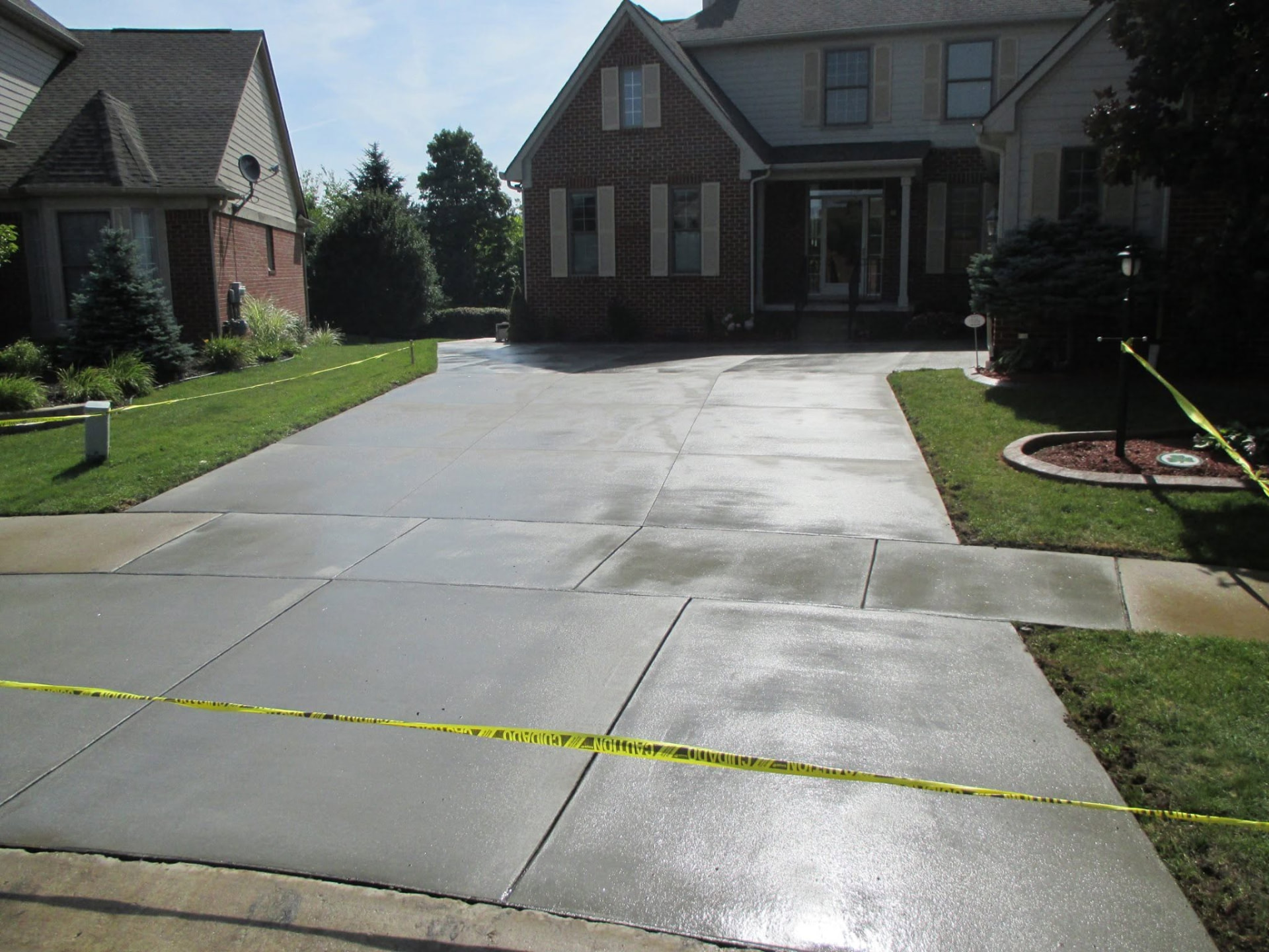 Finished concrete driveway and approach with saw-cut joints by Marcucci Concrete Construction in Oakland County, Michigan