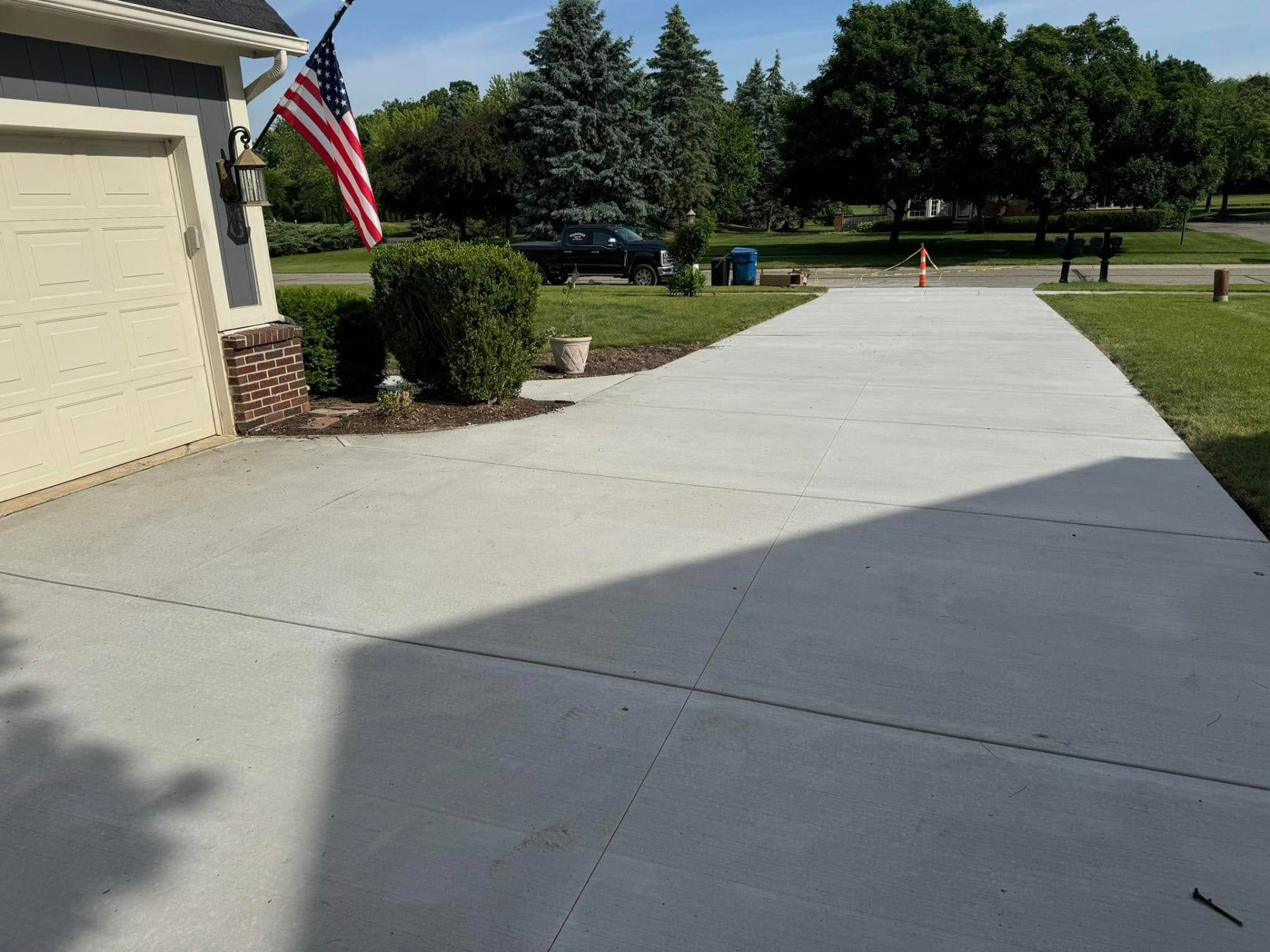 New concrete driveway with control joints installed by Marcucci Concrete Construction in Novi, Michigan