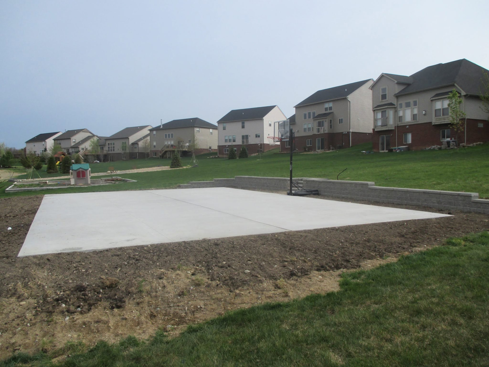 Backyard concrete basketball court slab by Marcucci Concrete Construction in Oakland County, Michigan