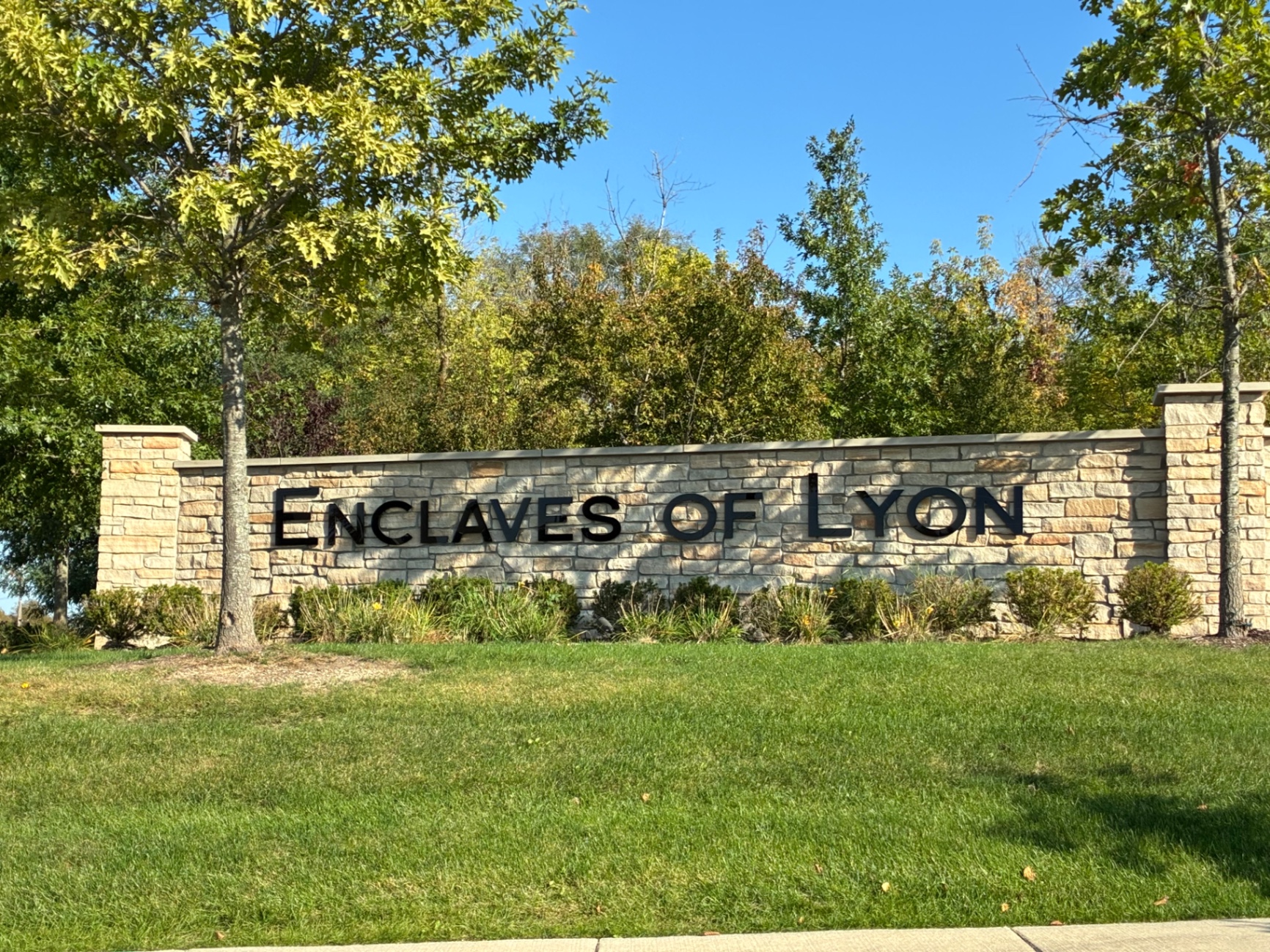Enclaves of Lyon subdivision stone entrance monument in Lyon Township, Michigan