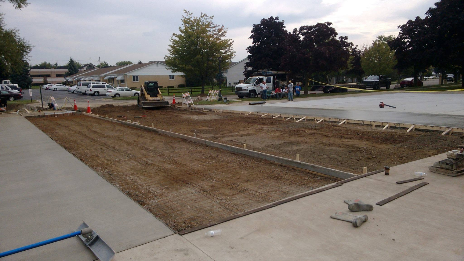Reinforced concrete parking lot replacement at an apartment community by Marcucci Concrete Construction in Wixom, MI