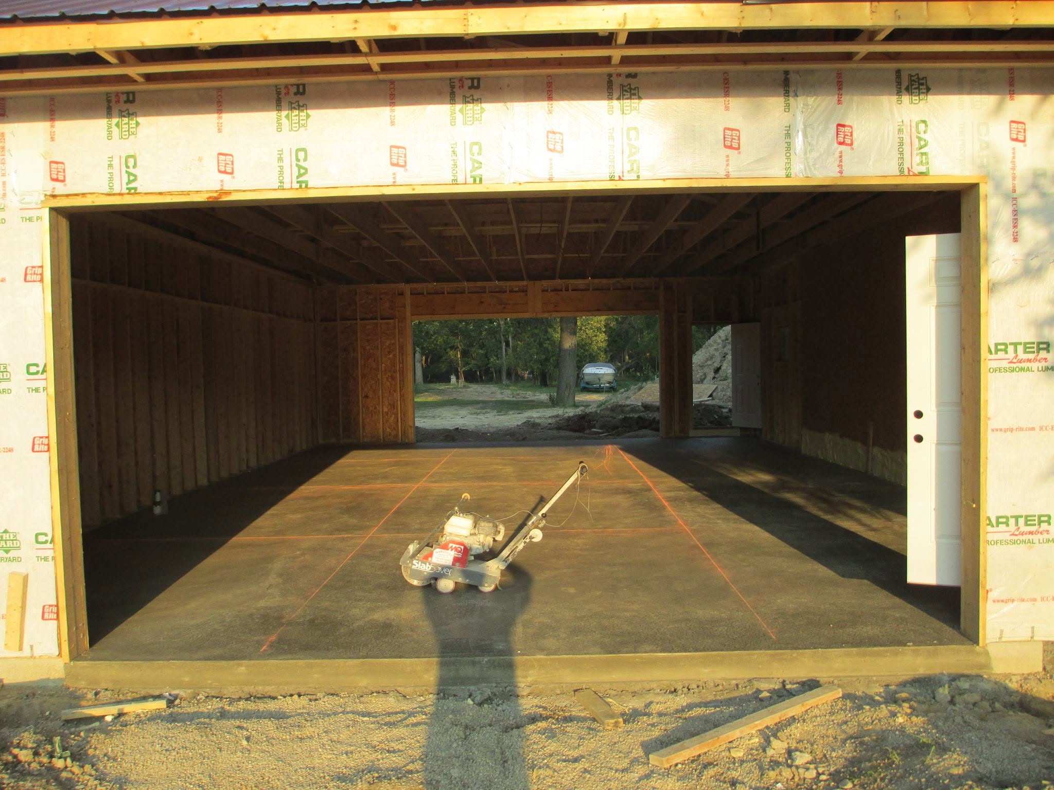 Fresh garage floor slab placed inside a new wood-frame build. Marcucci Concrete Construction in Oakland County, Michigan.