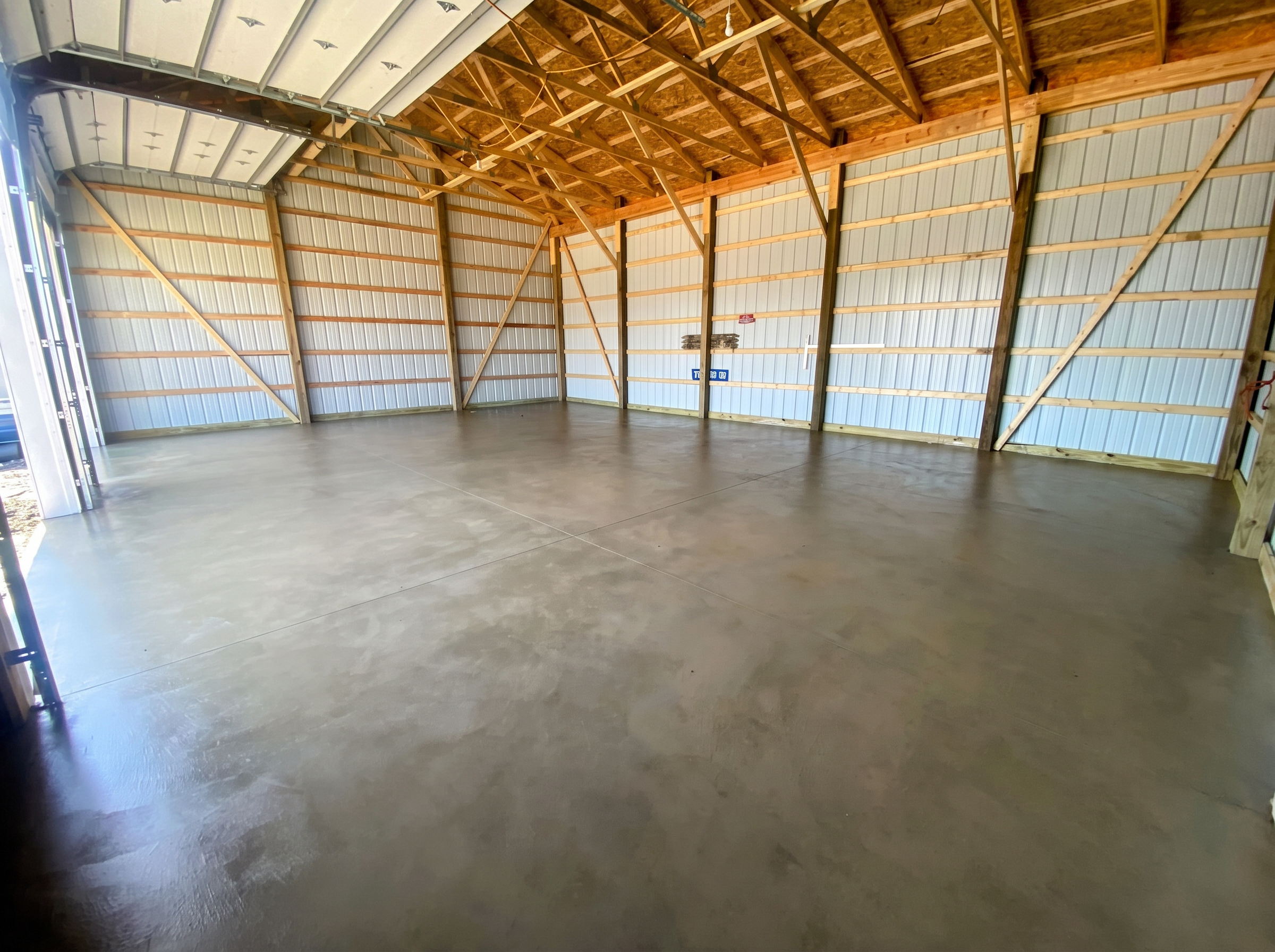 Finished commercial concrete slab with control joints inside a pole barn by Marcucci Concrete Construction in Oakland County, Michigan